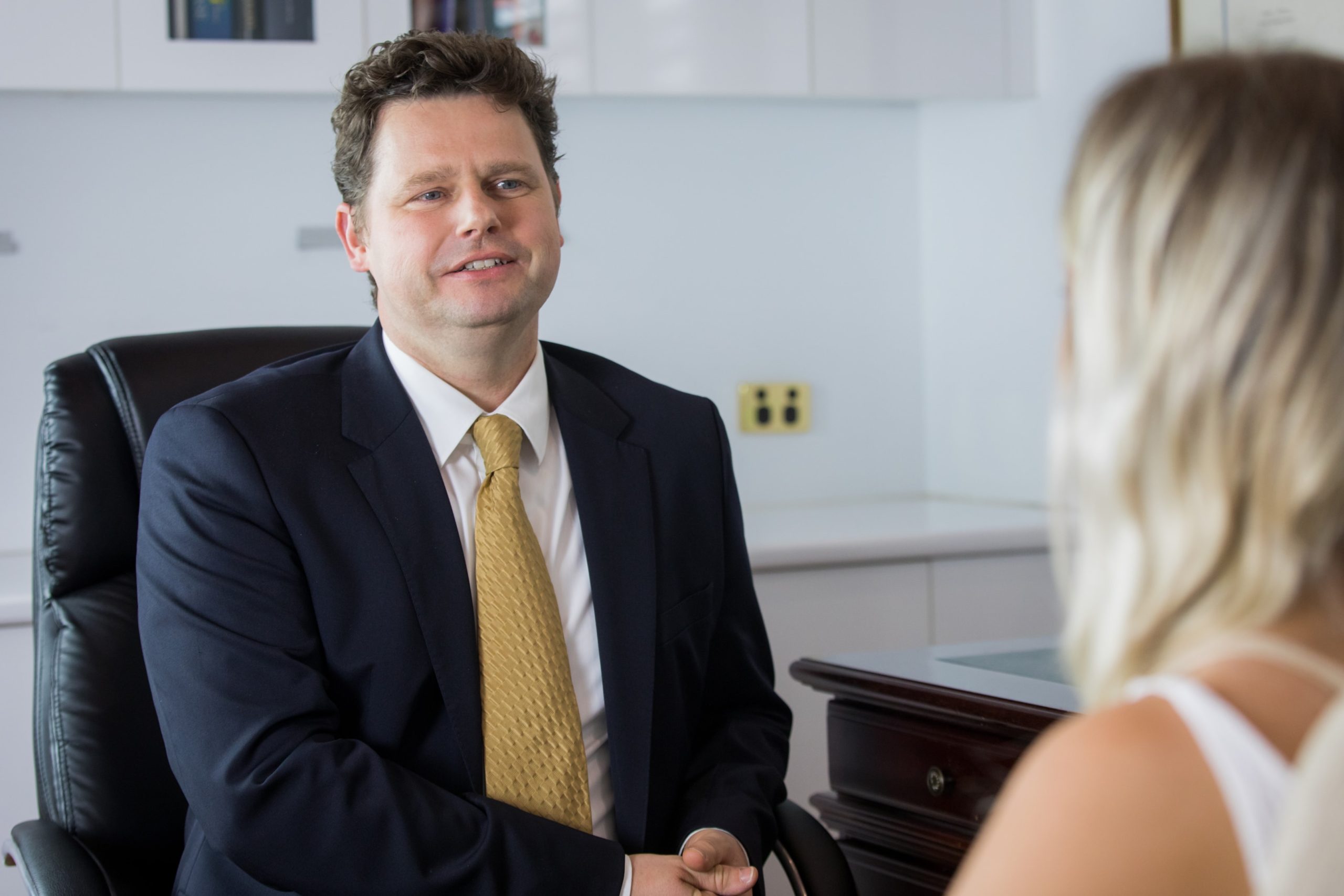 Dr Beldholm consulting with patient